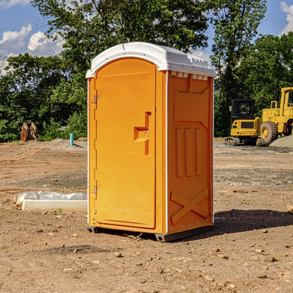 what is the cost difference between standard and deluxe portable restroom rentals in Marshall County